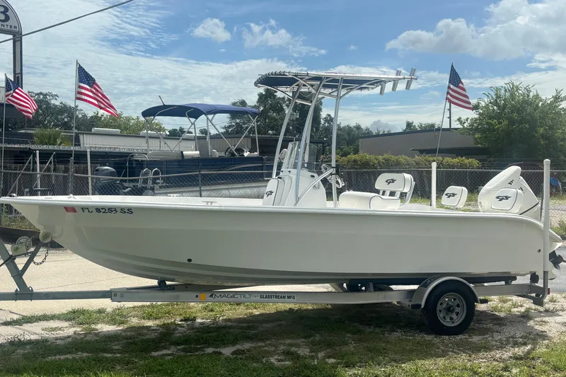 Slide: The Image of 2020 Glasstream 20 CCR boat on trailer, displayed outdoors with American flags. - 5