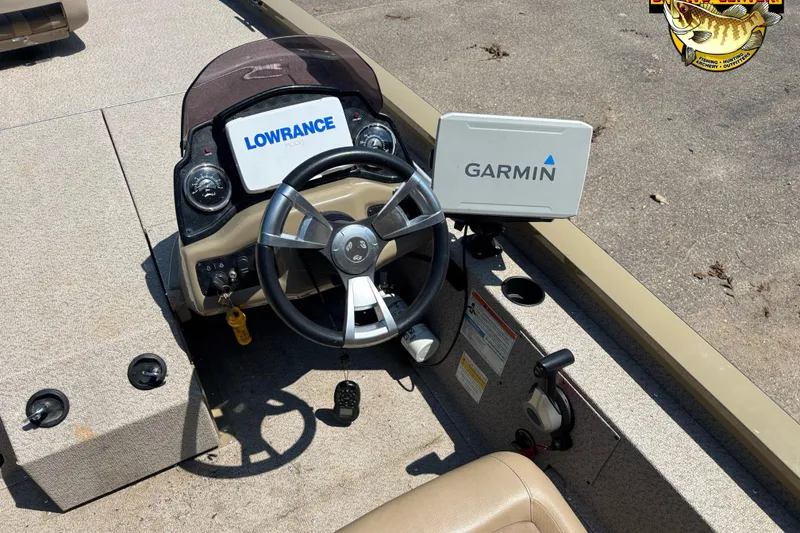 Slide: The Image of 2021 G3 Sportsman 1810 boat dashboard with Lowrance and Garmin navigation systems. - 6