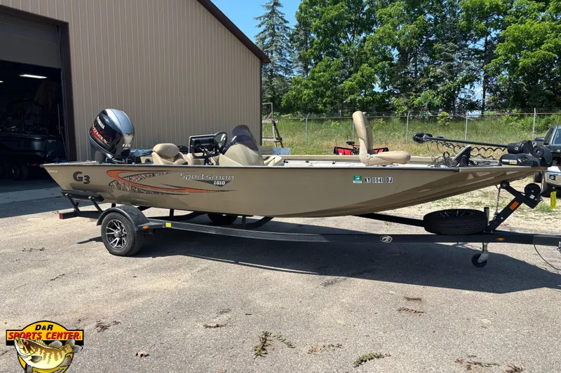 Slide: The Image of 2021 G3 Sportsman 1810 fishing boat on trailer, parked outdoors near a building. - 1