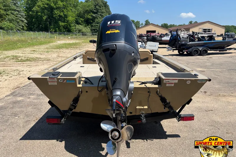 Slide: The Image of 2021 G3 Sportsman 1810 boat with Yamaha 115 outboard motor, parked outdoors. - 4