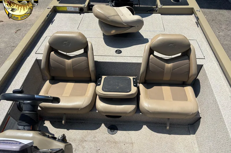Slide: The Image of 2021 G3 Sportsman 1810 boat interior with beige seating and steering console. - 8