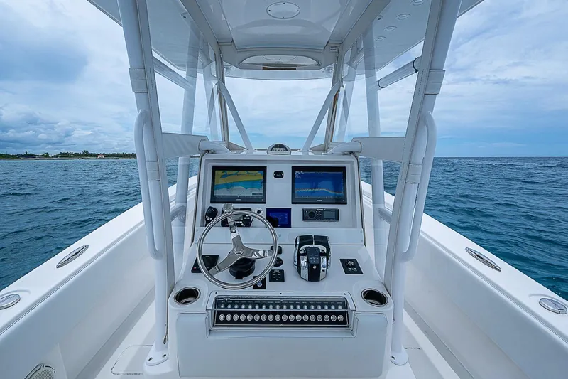Slide: The Image of 2018 Invincible 33 Open Fisherman boat dashboard with ocean view. - 35