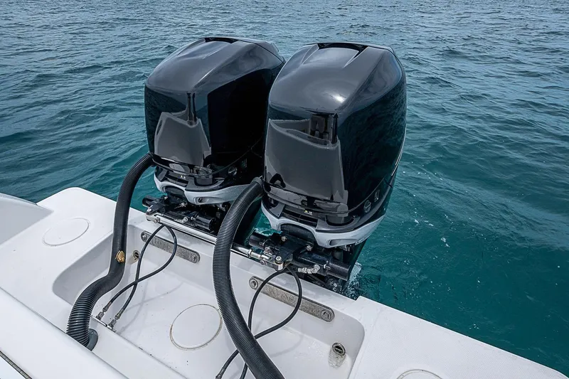 Slide: The Image of Twin outboard motors on a 2018 Invincible 33 Open Fisherman boat in the ocean. - 32