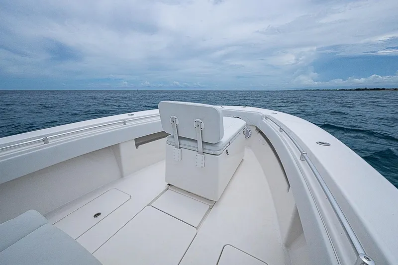 Slide: The Image of 2018 Invincible 33 Open Fisherman boat on open sea under cloudy sky. - 13