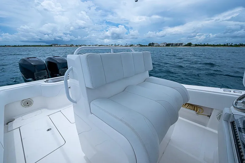 Slide: The Image of 2018 Invincible 33 Open Fisherman boat with dual engines on open water. - 37