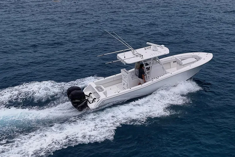 Slide: The Image of 2018 Invincible 33 Open Fisherman boat cruising on open water. - 6