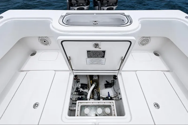 Slide: The Image of 2018 Invincible 33 Open Fisherman boat deck with open hatch and visible equipment. - 51