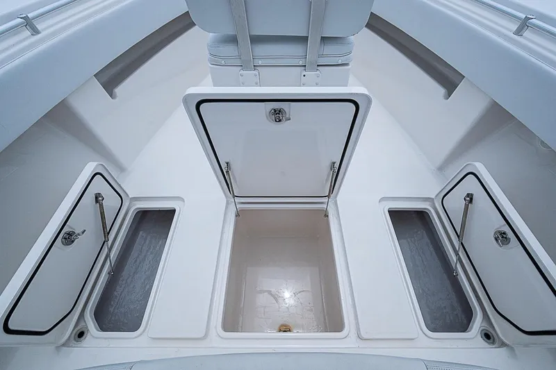 Slide: The Image of 2018 Invincible 33 Open Fisherman boat storage compartments, showcasing spacious and organized design. - 16