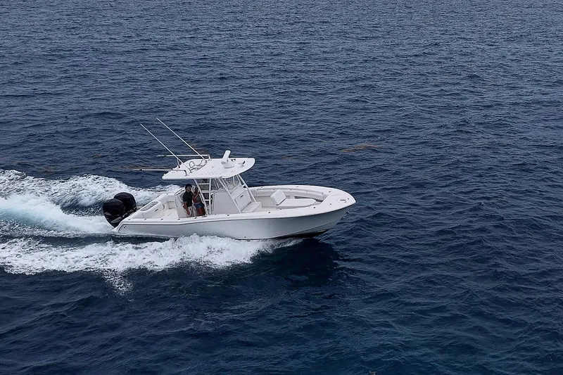 Slide: The Image of 2018 Invincible 33 Open Fisherman cruising on open ocean waters. - 10