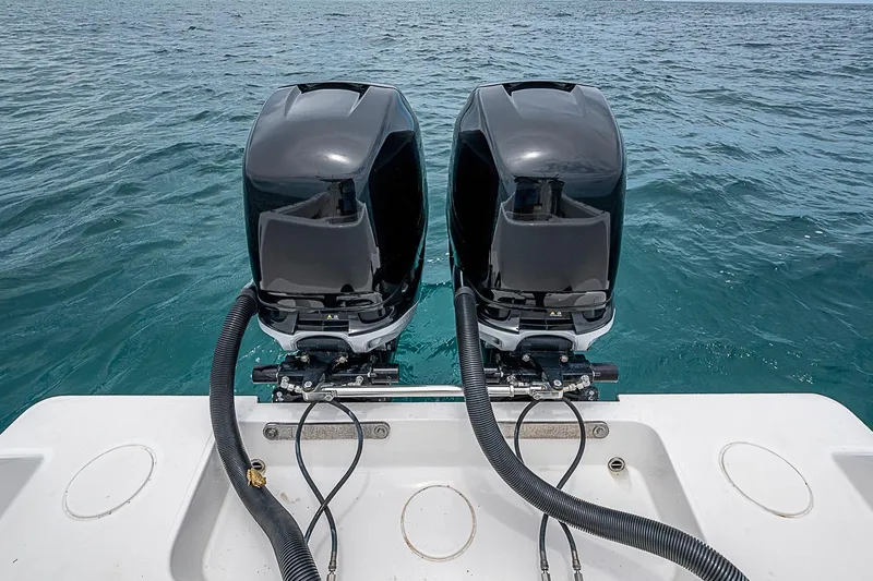 Slide: The Image of Twin outboard motors on a 2018 Invincible 33 Open Fisherman boat. - 31