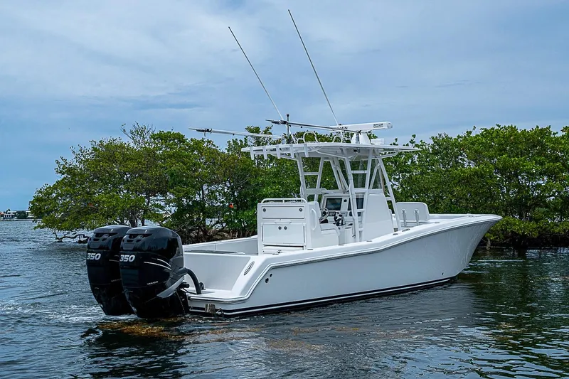 Slide: The Image of 2018 Invincible 33 Open Fisherman boat with dual engines on calm water. - 42
