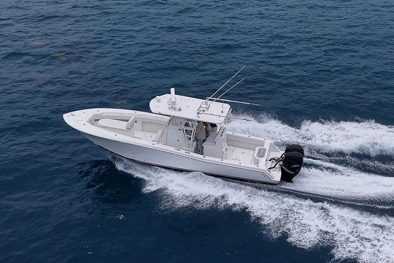 Slide: The Image of 2018 Invincible 33 Open Fisherman boat cruising on open water. - 8