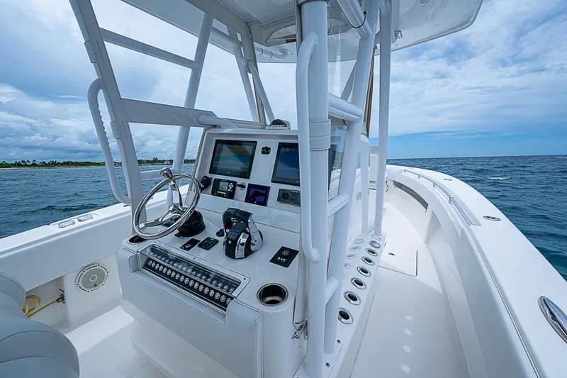 Slide: The Image of 2018 Invincible 33 Open Fisherman boat dashboard with ocean view. - 36