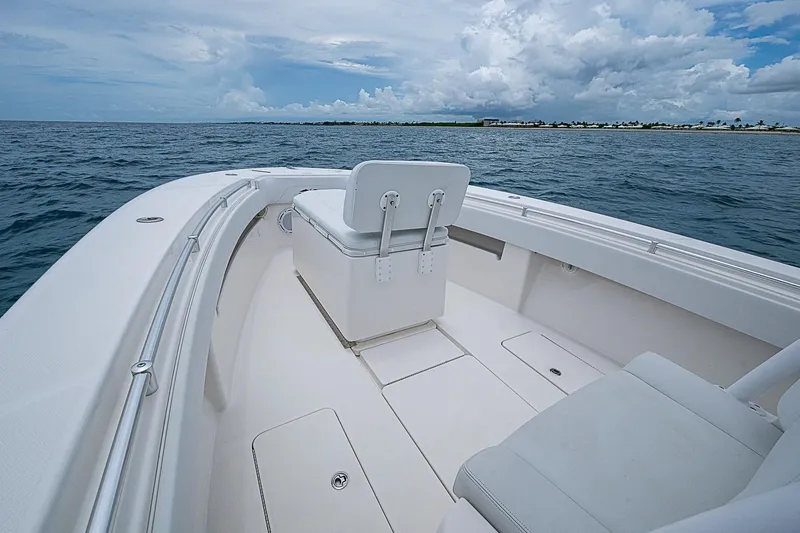 Slide: The Image of 2018 Invincible 33 Open Fisherman boat on calm ocean waters under cloudy sky. - 15