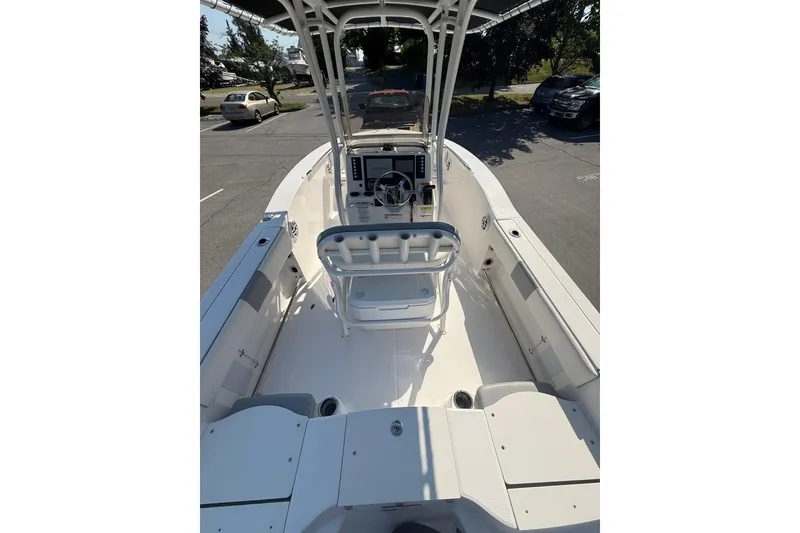 Slide: The Image of 2022 Robalo R200 Center Console boat interior with steering console and seating. - 9