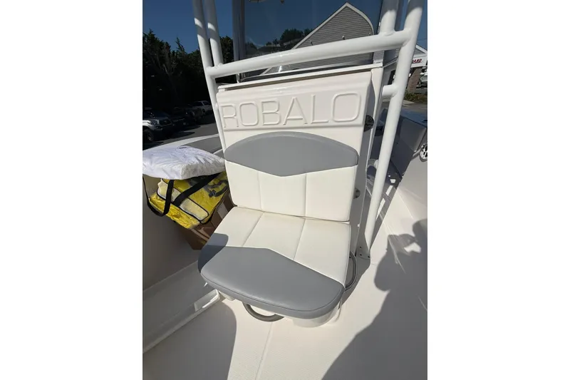 Slide: The Image of 2022 Robalo R200 Center Console boat seat with gray and white upholstery. - 19