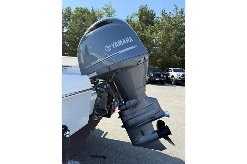 Slide: The Image of 2022 Robalo R200 Center Console with Yamaha outboard motor in parking lot. - 4