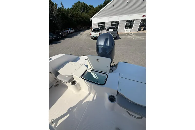 Slide: The Image of 2022 Robalo R200 Center Console boat interior with open storage compartments. - 11