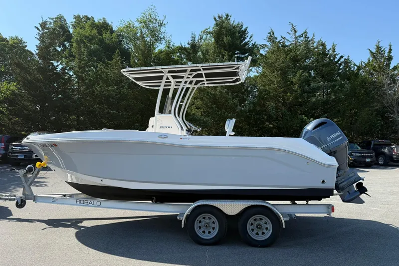 Slide: The Image of 2022 Robalo R200 Center Console boat on trailer, parked outdoors. - 3