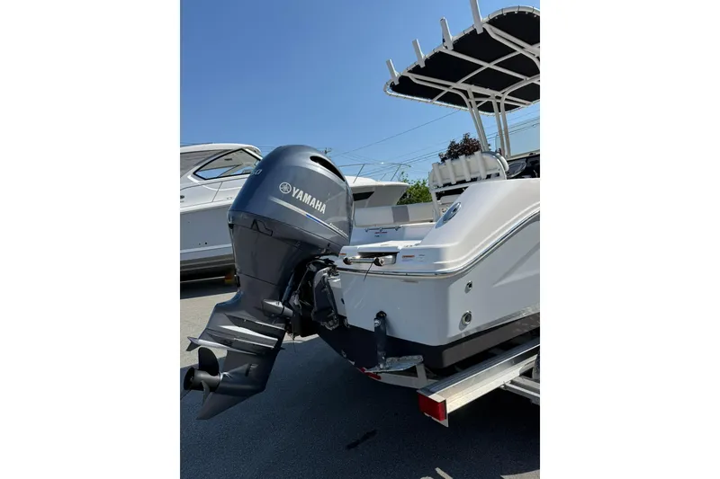 Slide: The Image of 2022 Robalo R200 Center Console boat with Yamaha outboard motor, parked on trailer. - 6