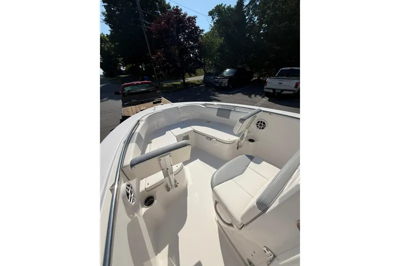 Slide: The Image of 2022 Robalo R200 Center Console boat interior with seating and speakers. - 16