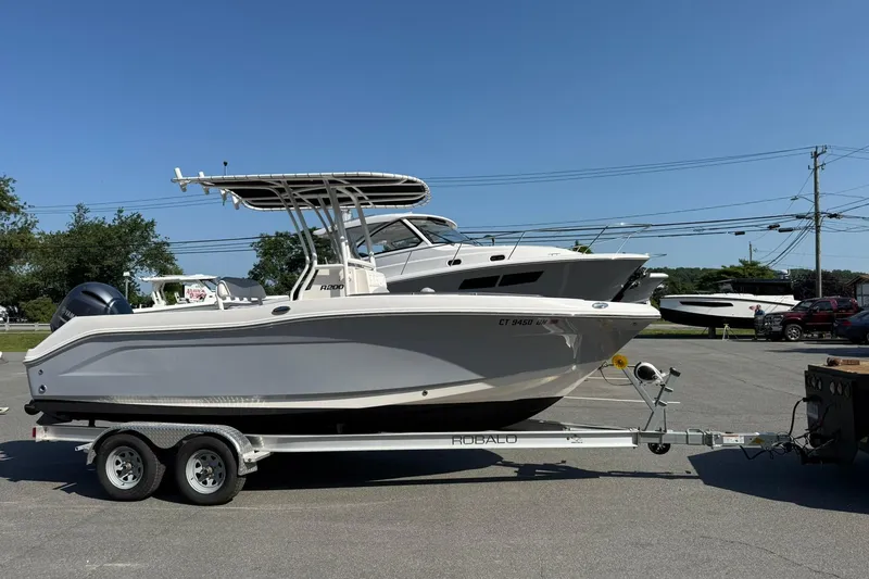 Slide: The Image of 2022 Robalo R200 Center Console boat on trailer in parking lot. - 8
