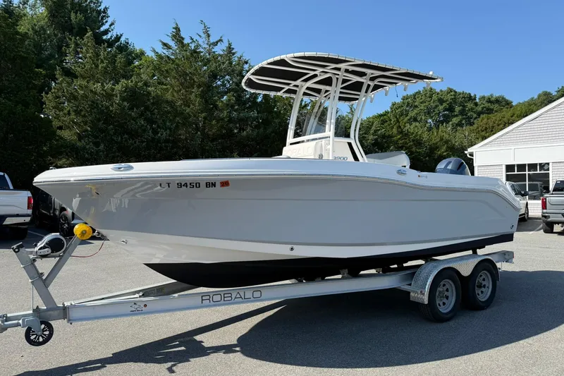 The Image of 2022 Robalo R200 Center Console boat on trailer, parked outdoors. - 0