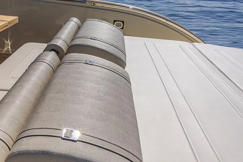 Slide: The Image of Luxury seating on 2025 Invictus 470 yacht, featuring elegant upholstery and ocean backdrop. - 2