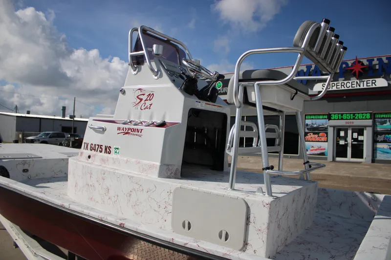 Slide: The Image of 2022 Shoalwater 20' Catamaran at dealership, featuring sleek design and modern seating. - 5