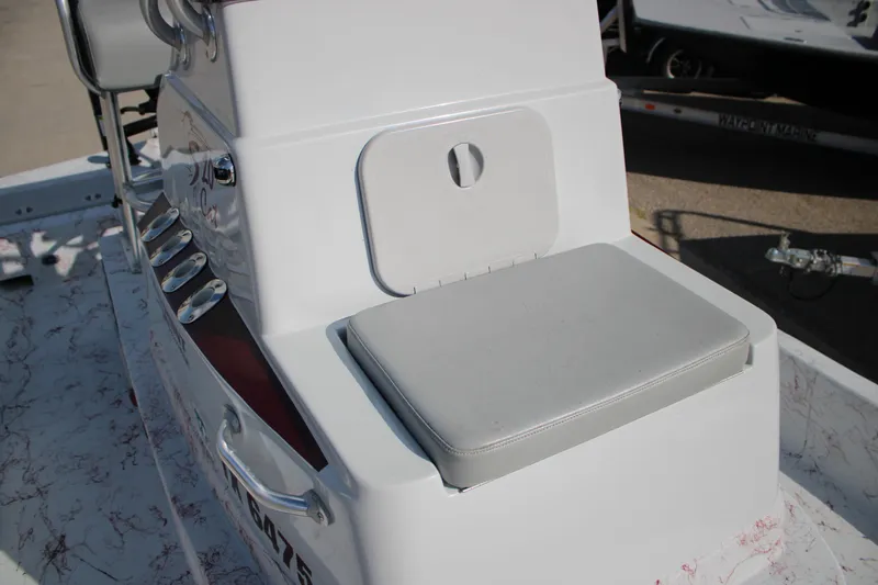 Slide: The Image of 2022 Shoalwater 20' Catamaran console with cushioned seat and rod holders. - 10