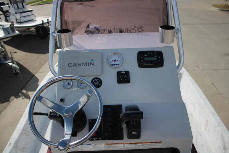 Slide: The Image of Dashboard of a 2022 Shoalwater 20' Catamaran featuring Garmin navigation equipment. - 8