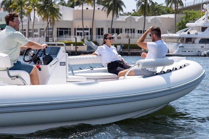 Slide: The Image of Manufacturer Provided Image: People relaxing on a Novurania Como 24 boat, 2026 model. - 1