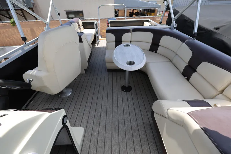 Slide: The Image of Luxurious interior of 2021 Lexington 525 Series 5 boat with plush seating and table. - 15