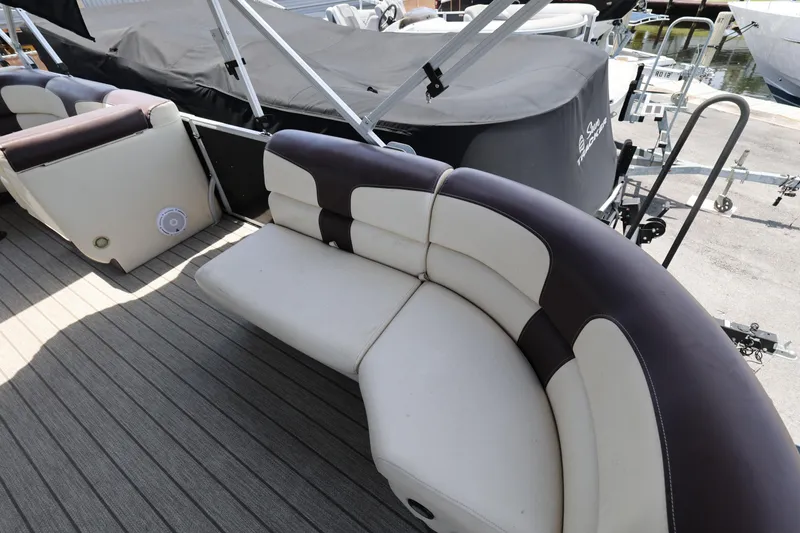 Slide: The Image of Luxurious seating on a 2021 Lexington 525 Series 5 boat, featuring elegant upholstery. - 11
