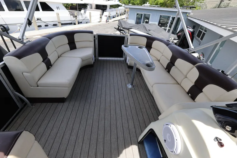 Slide: The Image of Luxurious seating area on a 2021 Lexington 525 Series 5 boat, featuring plush upholstery and a sleek design. - 24