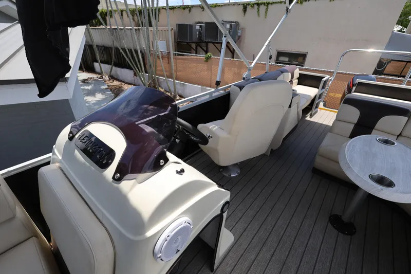 Slide: The Image of Luxurious interior of 2021 Lexington 525 Series 5 boat with plush seating and modern helm. - 14