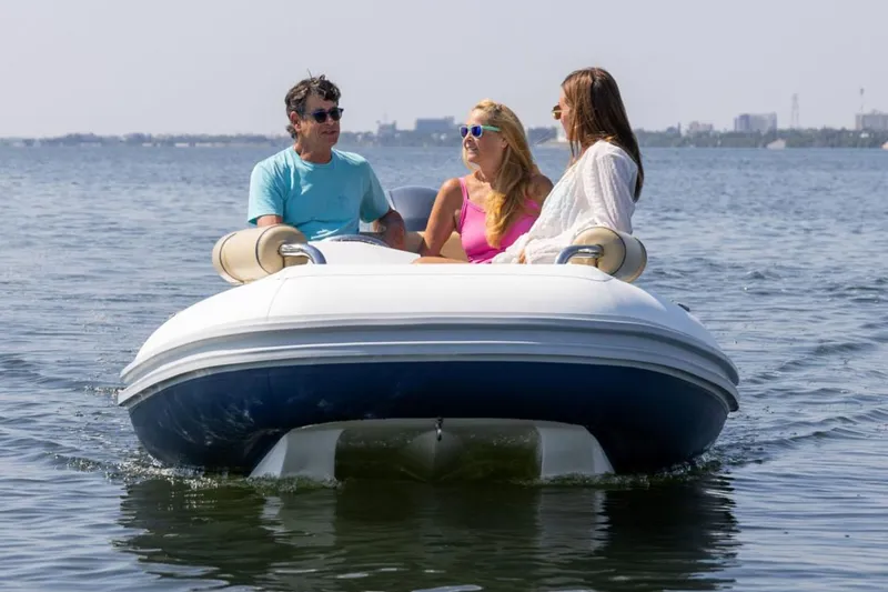 Slide: The Image of Manufacturer Provided Image: Three people on a 2026 Novurania Catamaran 450 on the water. - 1