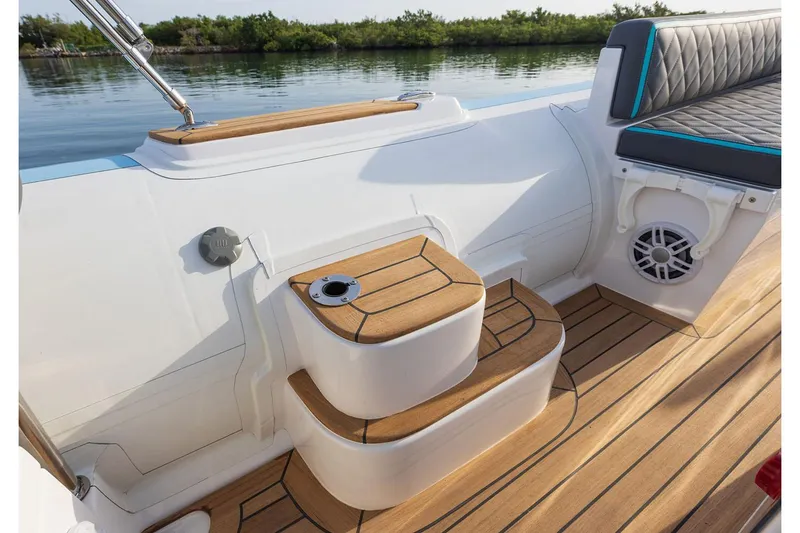 Slide: The Image of Manufacturer Provided Image: Interior of Novurania Catamaran 24, 2026 model, featuring wooden flooring and seating area. - 2