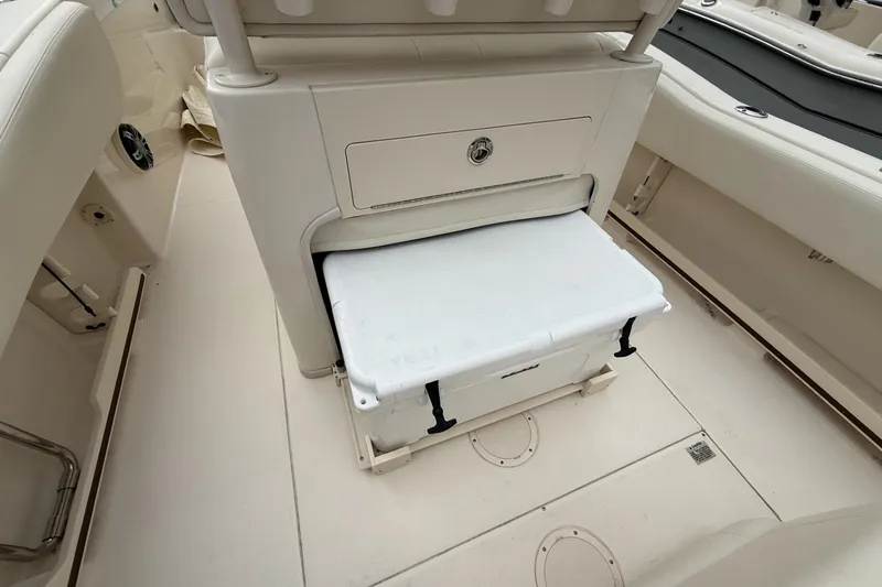 Slide: The Image of 2020 Grady-White Fisherman 257 boat interior with storage compartment and cooler. - 17