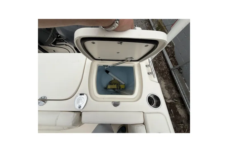 Slide: The Image of 2020 Grady-White Fisherman 257 boat livewell with open lid, showcasing interior features. - 15
