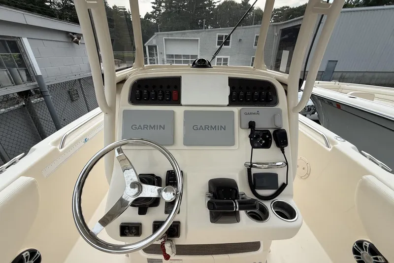 Slide: The Image of 2020 Grady-White Fisherman 257 helm with Garmin electronics and steering wheel. - 6