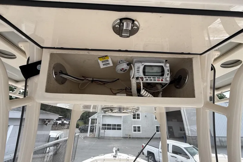 Slide: The Image of 2020 Grady-White Fisherman 257 boat console with electronic equipment and wiring. - 25
