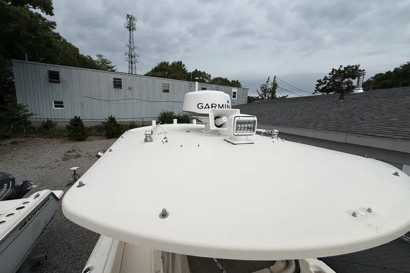 Slide: The Image of 2020 Grady-White Fisherman 257 boat with Garmin radar, parked outdoors. - 23