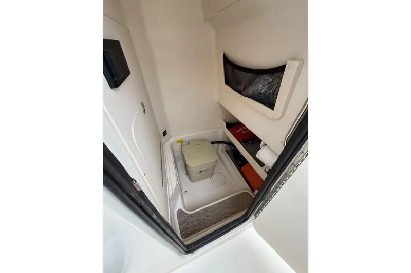Slide: The Image of Interior of 2020 Grady-White Fisherman 257 boat, featuring compact storage and equipment space. - 19