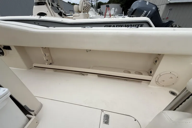 Slide: The Image of 2020 Grady-White Fisherman 257 boat interior, showcasing seating and storage area. - 22