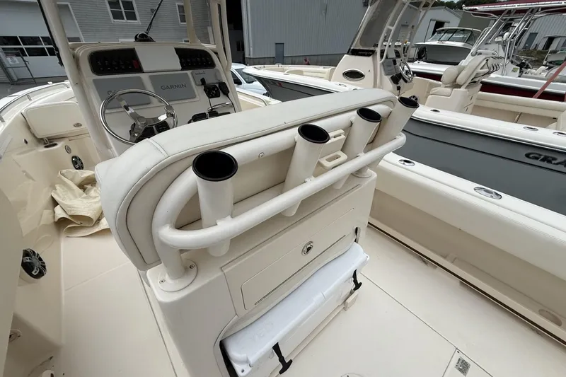 Slide: The Image of 2020 Grady-White Fisherman 257 boat interior with rod holders and Garmin navigation system. - 18