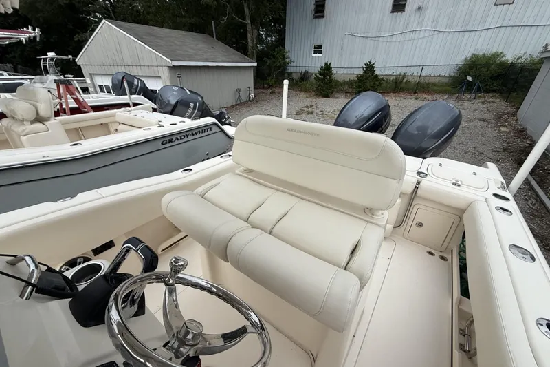 Slide: The Image of 2020 Grady-White Fisherman 257 boat with dual engines and sleek interior design. - 12