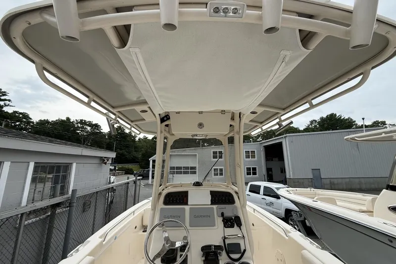 Slide: The Image of 2020 Grady-White Fisherman 257 boat interior with steering wheel and Garmin navigation system. - 7