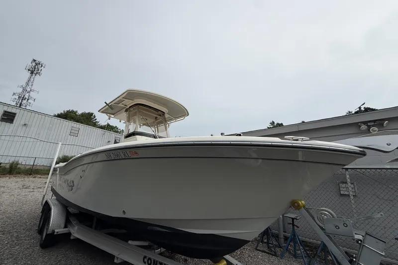 Slide: The Image of 2020 Grady-White Fisherman 257 boat on trailer, parked outdoors near a building. - 33