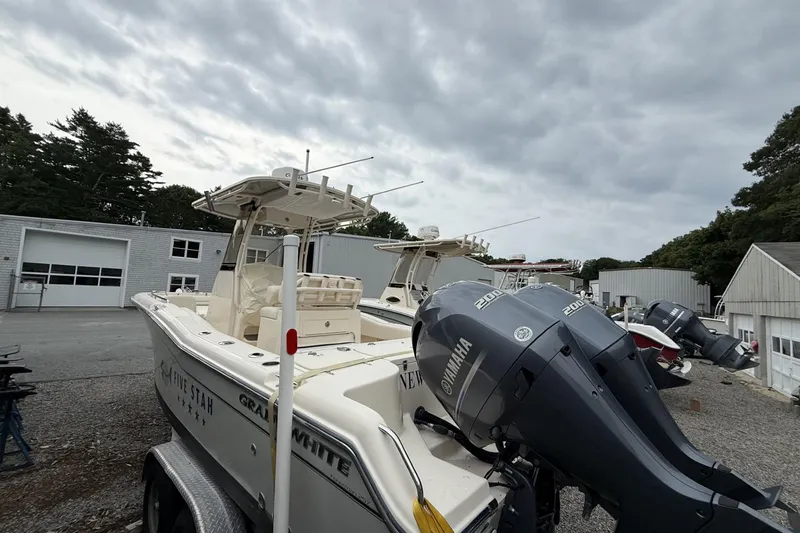 Slide: The Image of 2020 Grady-White Fisherman 257 boat with Yamaha engines in a marina setting. - 3